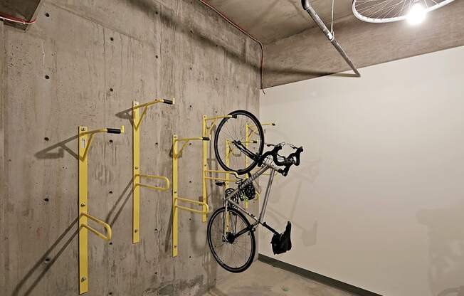 Community bike storage room with bike hanging on wall.at 19th & Mercer, Seattle, 98112