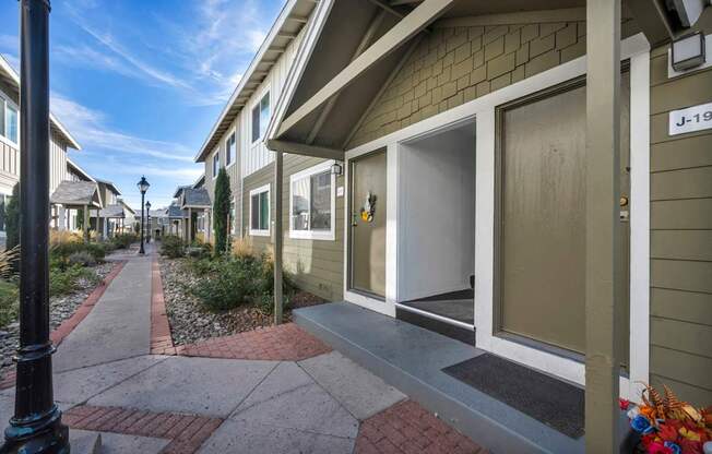 A residential street with a house numbered J-19.