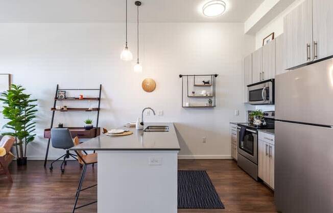 a kitchen with a counter top and a refrigerator