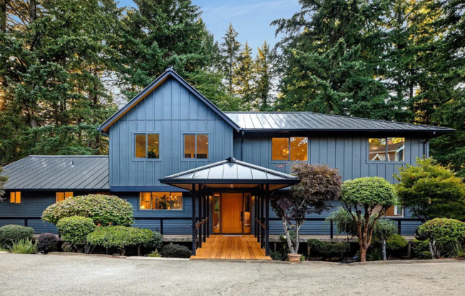 Welcome to your Private Luxury Sanctuary that Sits on 1.66 Serene Acres Complete with ADU and Private Walking Trails!