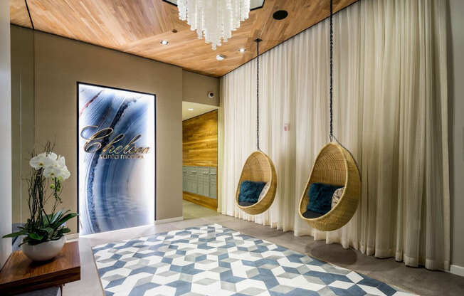 A room with a wooden ceiling and a large rug on the floor.