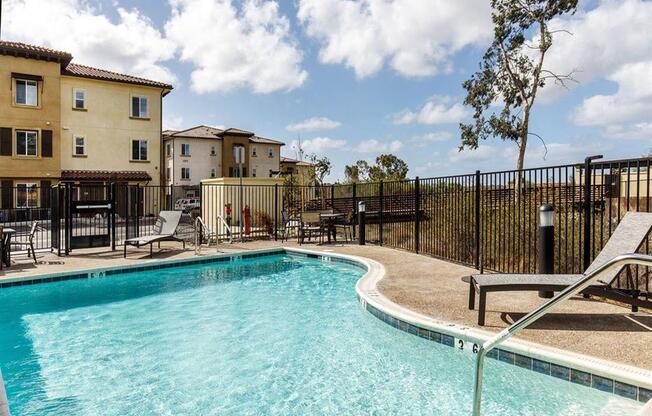 Pool area with chairs around to sit