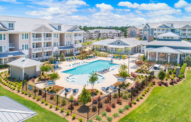 Aerial view of The Highland apartment community with resort-style swimming pool and amenities in Augusta, GA