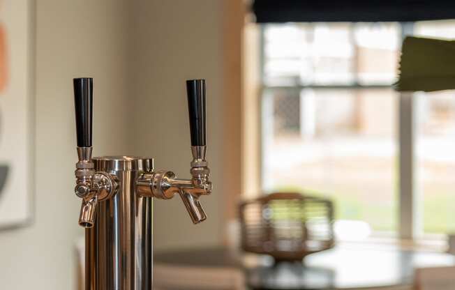 a close up of a table top with a wooden table and a window in the background at The Bend Arbordale, Williamsburg, Virginia