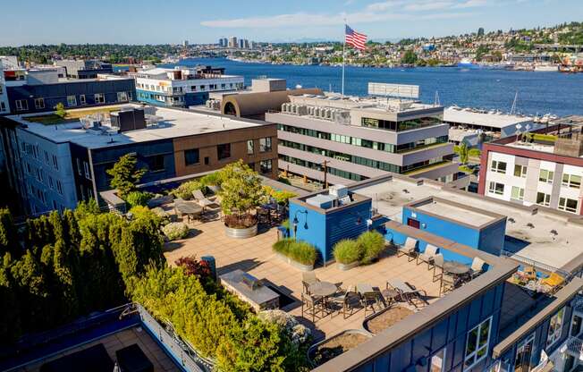 a view from above of a building with a flag on top and a body of water in at Dexter Lake Union, Seattle