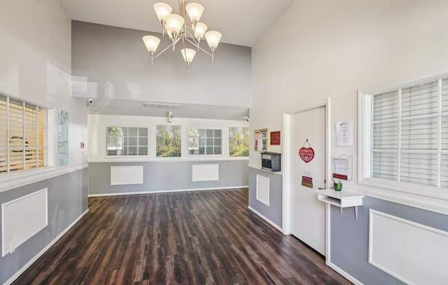 A room with wooden floors and white walls.