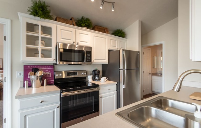 This is a photo of the kitchen in the 1016 square foot, 2 bedroom, 2 bath Nautica floor plan at Nantucket Apartments in Loveland, OH.