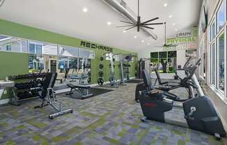 Community Fitness Center with Equipment at Broadmoor Village Apartments located in West Jordan, UT.