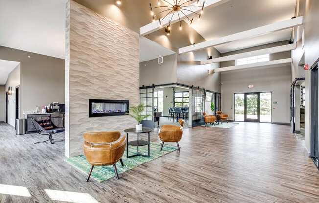a large lobby with tables and chairs and a bar