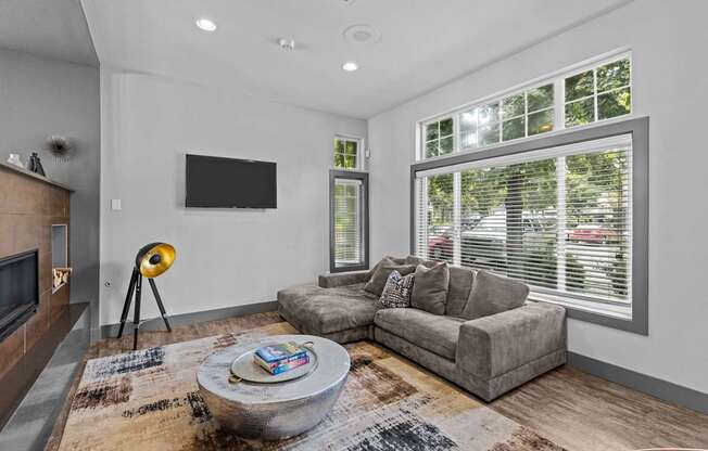 a clubhouse with Crosspointe Apartments Clubhouse with Couch and Fireplace