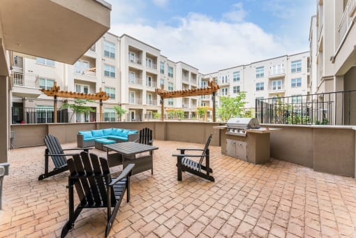 Spacious Patio With Sitting Arrangements with BBQ at Residences at 3000 Bardin Road, Grand Prairie, TX, Texas