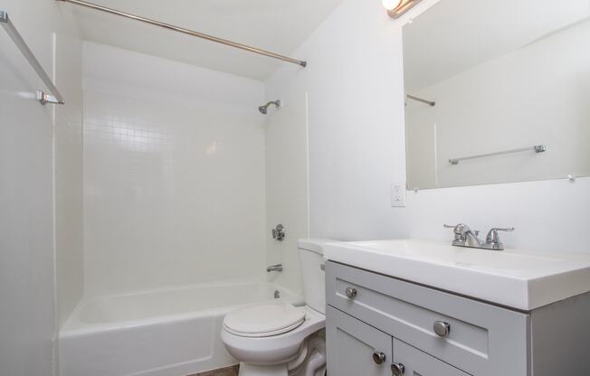 a bathroom with a sink toilet and a bath tub at Palms of Kilani Apartments, Wahiawa, Hawaii