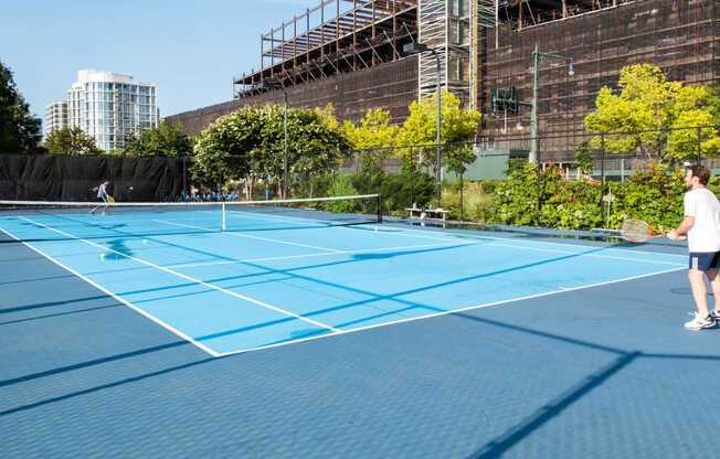 Hit the various sports courts at the Hudson River Greenway park.