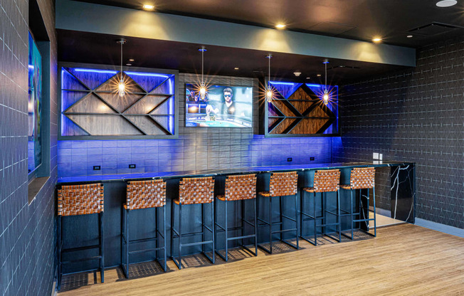 3thirty3 new rochelle ny apartment high rise photo of sports pub area with bar seating and multiple televisions TVs and modern furniture and lighting