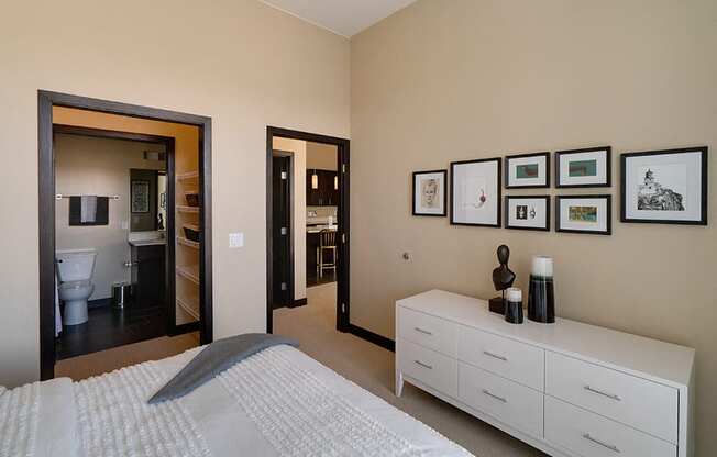 Bedroom with connected walk in closet and bathroom