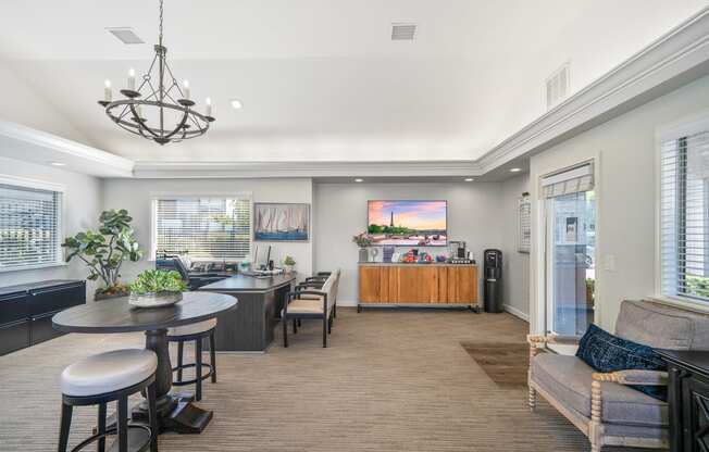a living room with a kitchen and a dining room