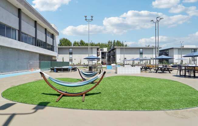 a courtyard with a hammock in the middle of a building