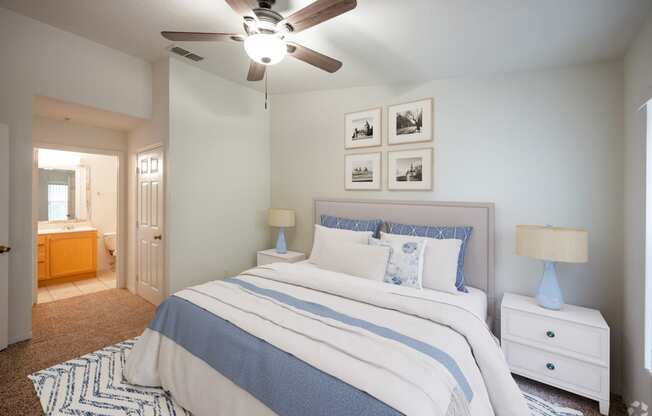 a bedroom with a bed and a ceiling fan