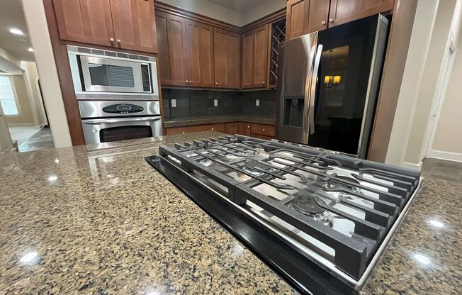 Elegant 4-Bed, 2.5-Bath Home with Gourmet Kitchen, Expansive Primary Suite & Lush Backyard Retreat