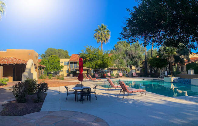 Sparkling pool and lounge area at La Hacienda Apartments in Tucson, AZ!