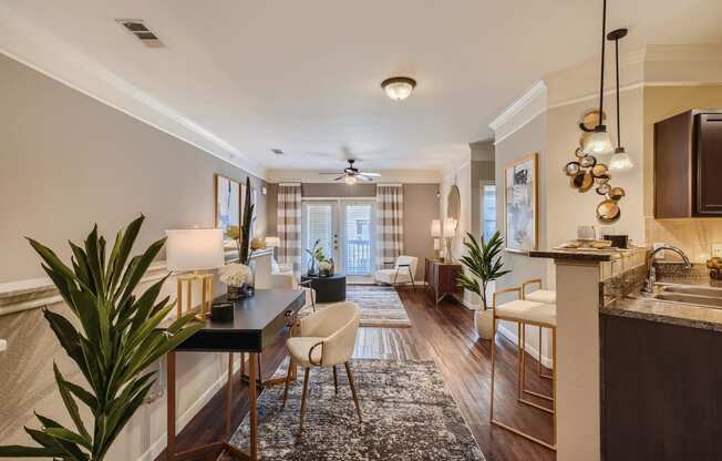 a living room with a kitchen and a dining room