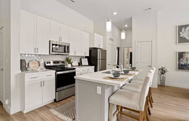 an open kitchen and dining area with a table and chairs at 200 City View, Provo, UT, 84601
