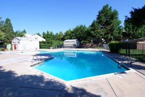 ENJOY THE POOL THIS SUMMER IN THIS GATED COMMUNITY
