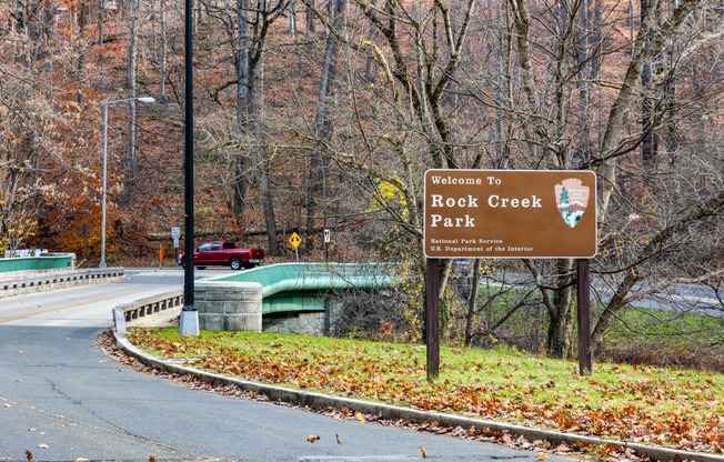 a sign park on the side of a road