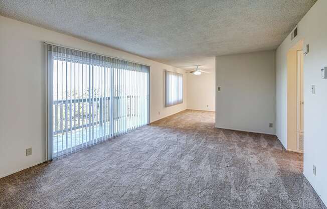 an empty living room with a sliding glass door at Terrace View Apartments, California, 94015