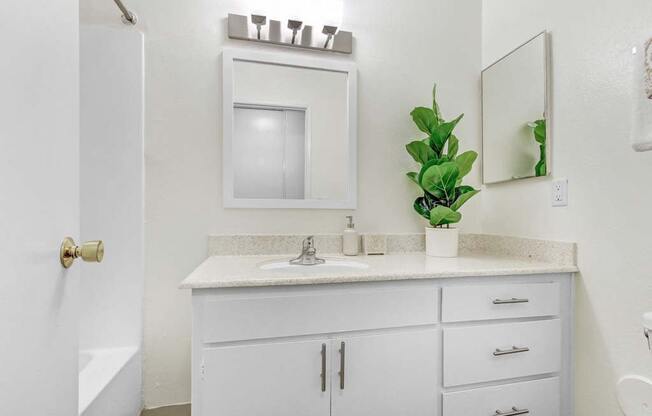 a bathroom with a sink and a mirror  at Sherway Villa, Reseda