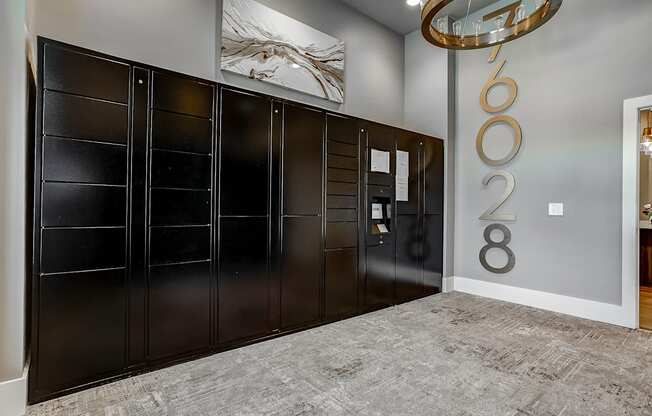 a modern and funky half bathroom reveal with black and white tile in a modern laundry room