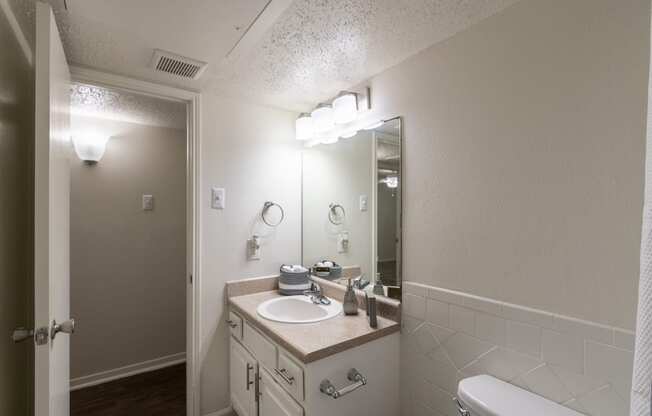 This is a photo of the bathroom in the 871 square foot 2 bedroom, 2 bath apartment at Princeton Court Apartments in the Vickery Meadow neighborhood of Dallas, Texas.