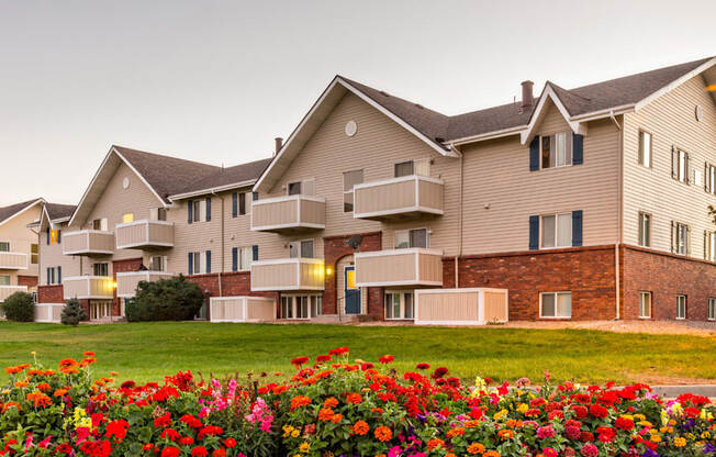 Back exterior view of apartments with private balconies in Aurora, CO.