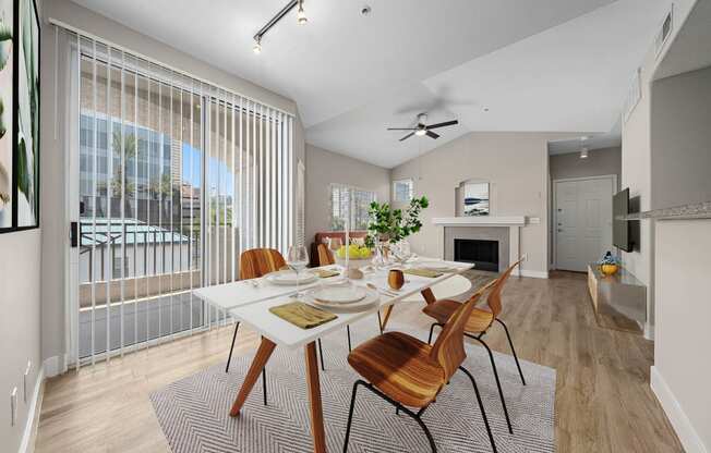 a dining room with a table and chairs and a fireplace