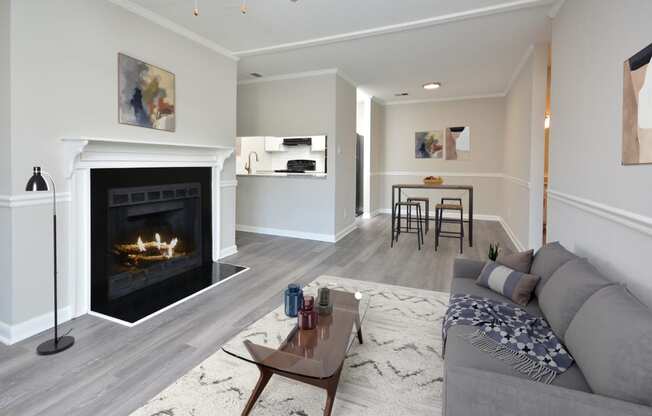 a living room with a fireplace and a couch