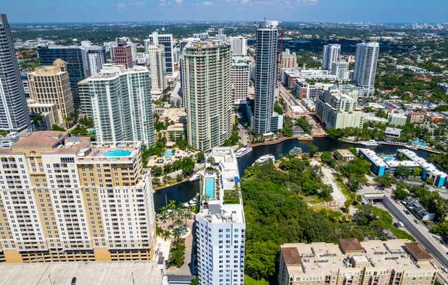 a view of a city with tall buildings and a river