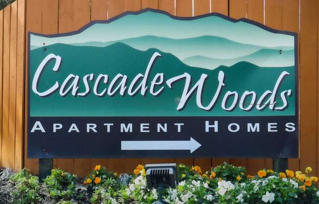 the sign for cascade woods apartment homes