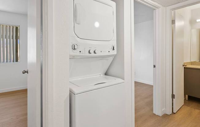 A white oven and microwave in a kitchen.