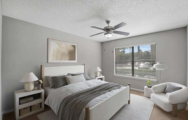 Model Bedroom with Carpet and Window View at Fountains Lee Vista Apartments in Orlando, FL.