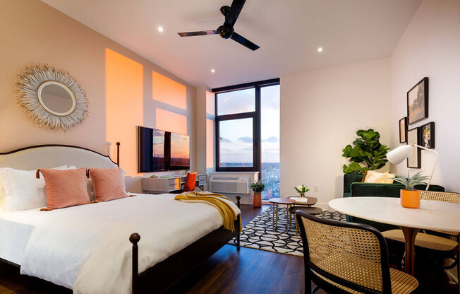 a bedroom with a bed and a table and a living room at The Irvine, Philadelphia, Pennsylvania