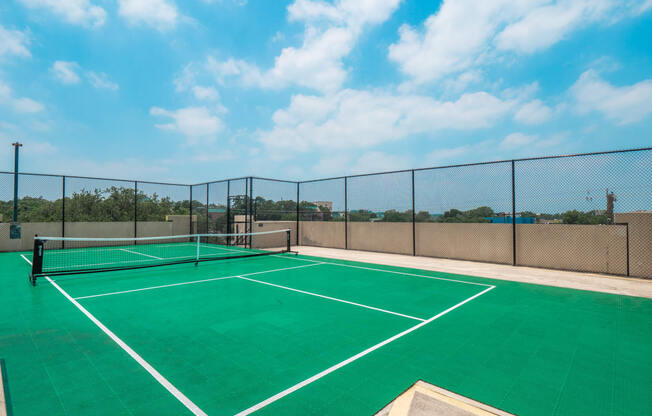 a tennis court on the roof of a building