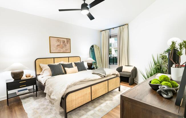 A spacious bedroom at Modera Nations in Nashville features wide-plank flooring, abundant natural light, and a clean, versatile layout for everyday living.