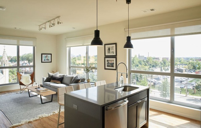 the living room and kitchen of an apartment at The Audubon New Haven, New Haven, 06511
