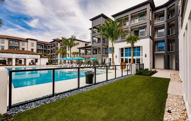 Side yard at the pool at Harrison Apartments, Florida, 34243