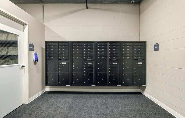 a view of the lockers in a room with a door at The Standard on 32nd, West Fargo, ND, 58078