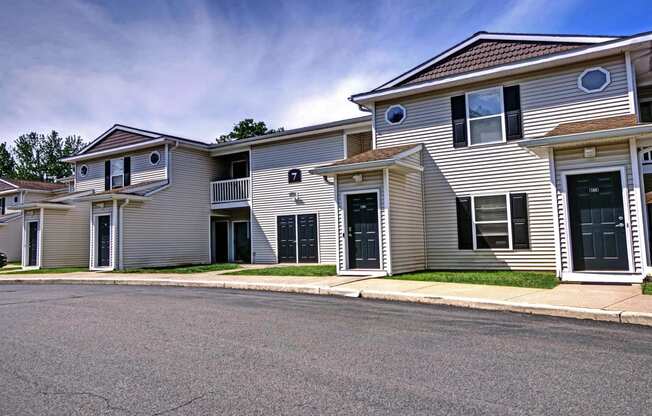 a row of houses on the side of a street