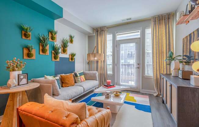 a living room filled with furniture and a large window