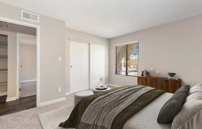 Model apartment bedroom with a large bed and a window at Saratoga Ridge, Arizona, 85022