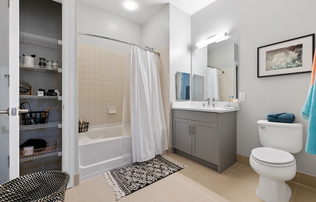 a bathroom with a shower toilet and sink