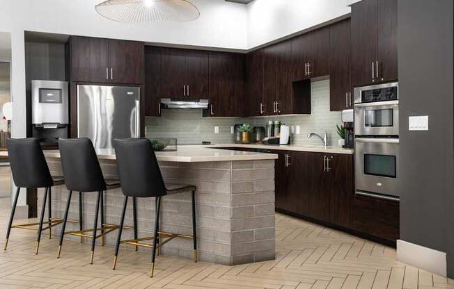 A modern kitchen with dark wood cabinets and a central island.